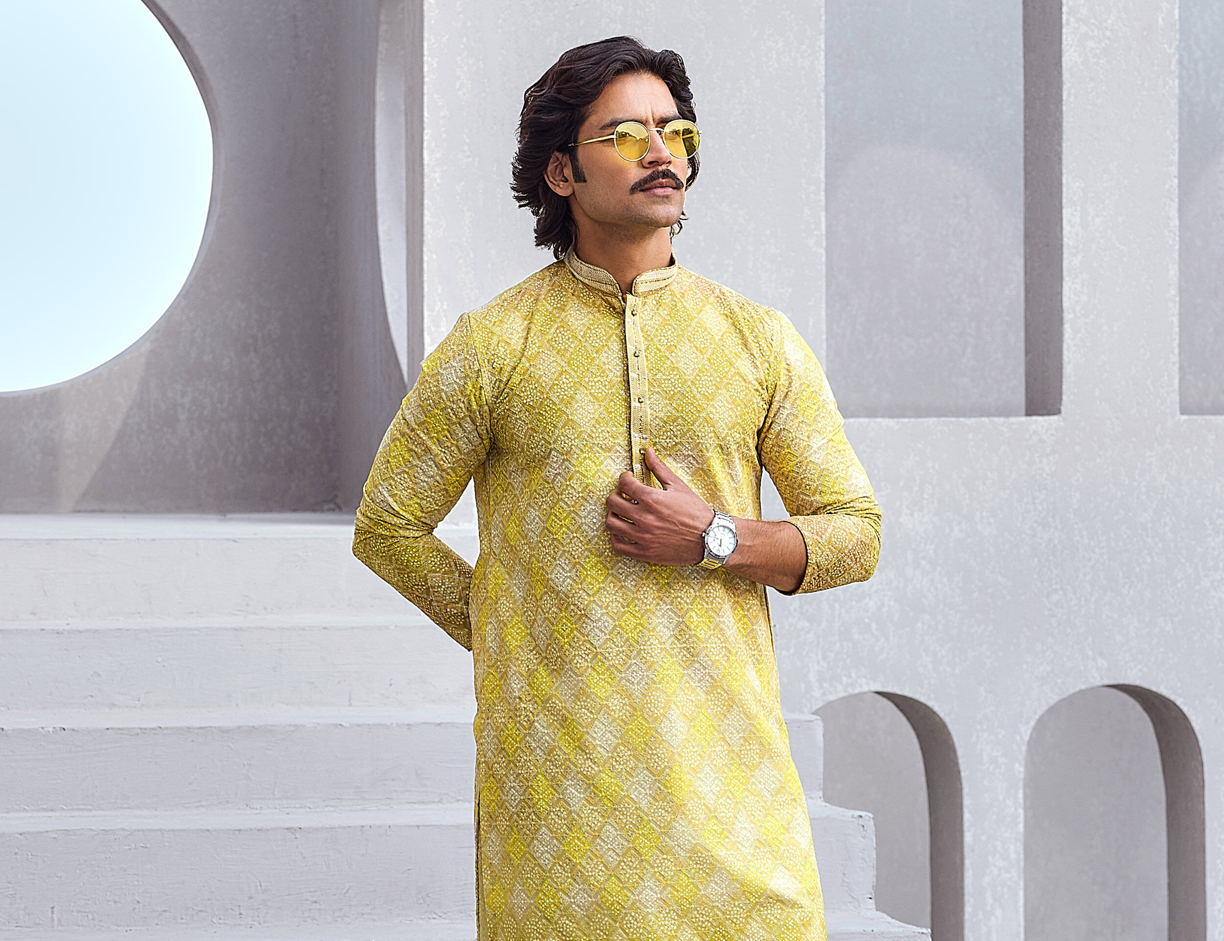  Man wearing a green dotted printed kurta and sunglasses for a stylish wedding look